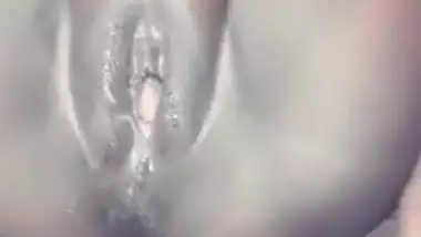 Showing her wet pussy