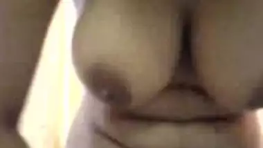 Busty Indian chick gives head.